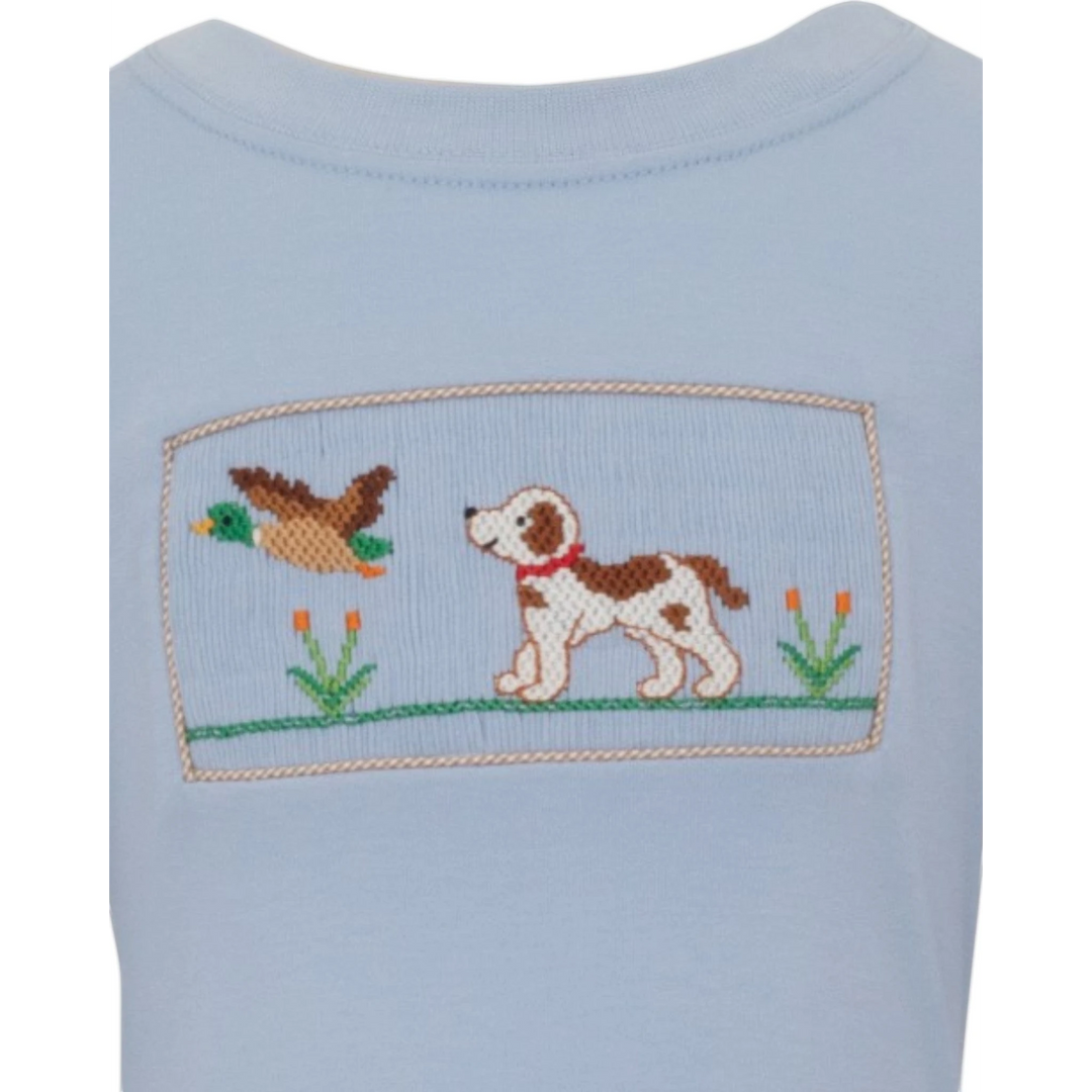 That Store blue cotton boys tee featuring a hand-smocked hunting dog and mallard duck design with gingham trim.