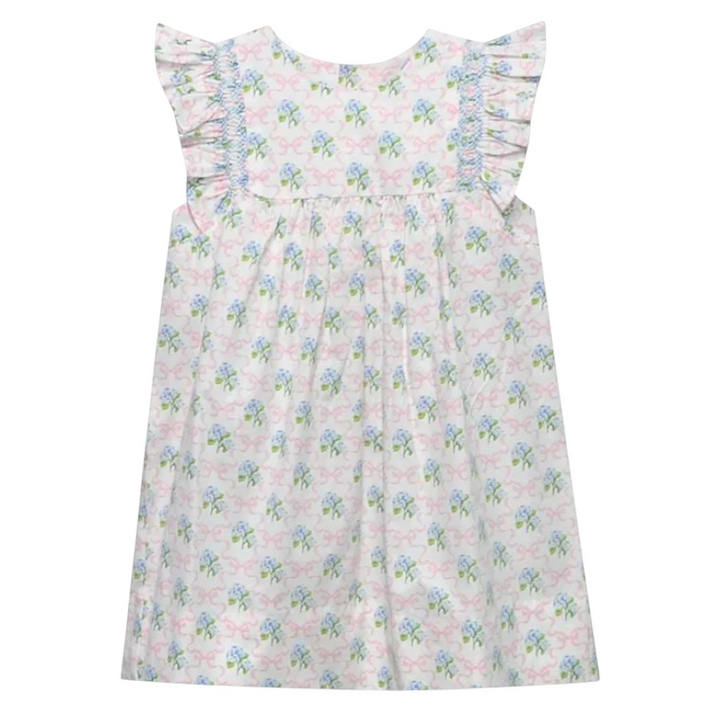 That Store girls dress with blue hydrangea and pink bow print, angel wing sleeves, and blue smocked detailing.