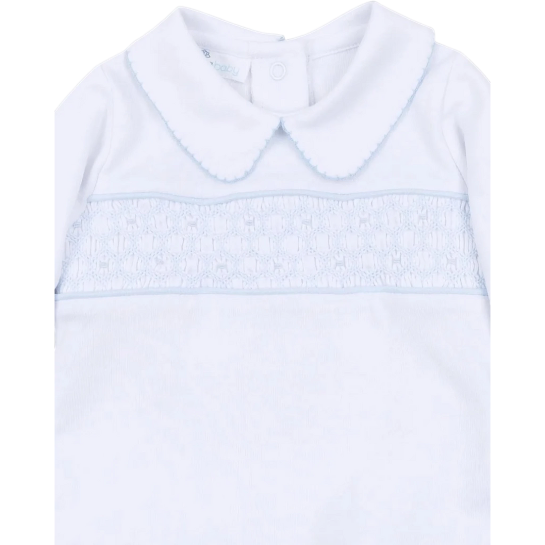That Store Magnolia Baby light blue smocked long sleeve Pima cotton top with a peter pan collar and button back.