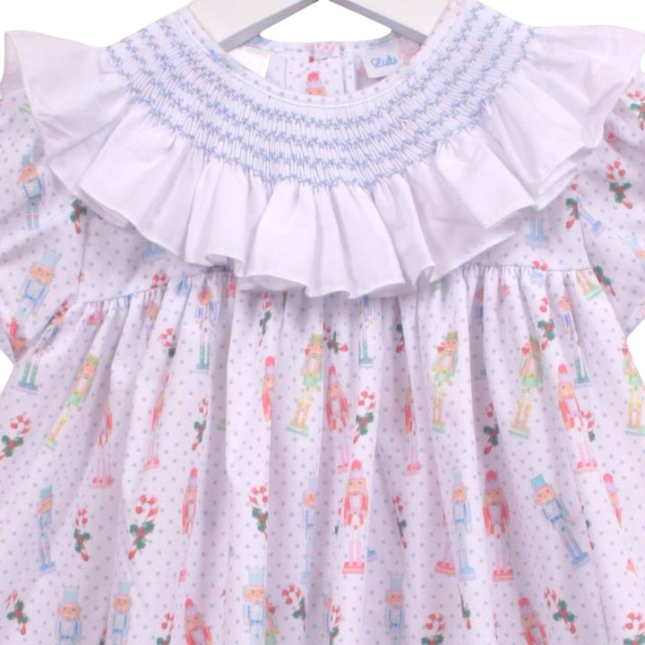 That Store girls smocked bloomer set with white ruffled collar and blue nutcracker print on a white dotted fabric