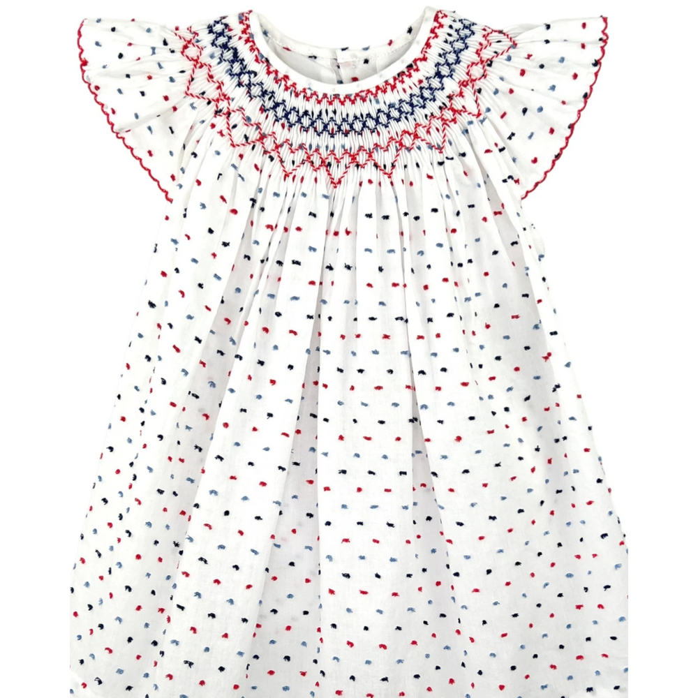 That Store smocked cotton bishop dress in white with red and blue dot pattern and angel wing sleeves