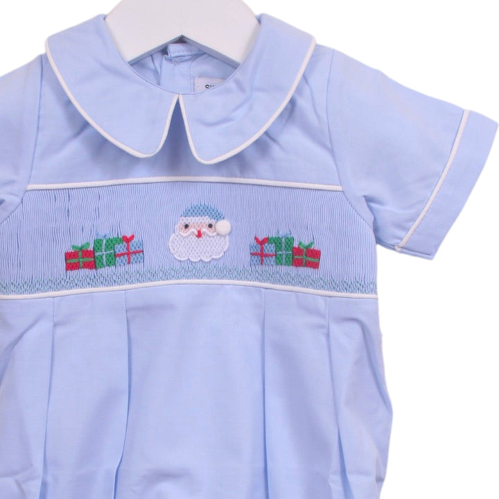That Store light blue boys bubble with smocked Santa and presents embroidery, peter pan collar, and white piping.