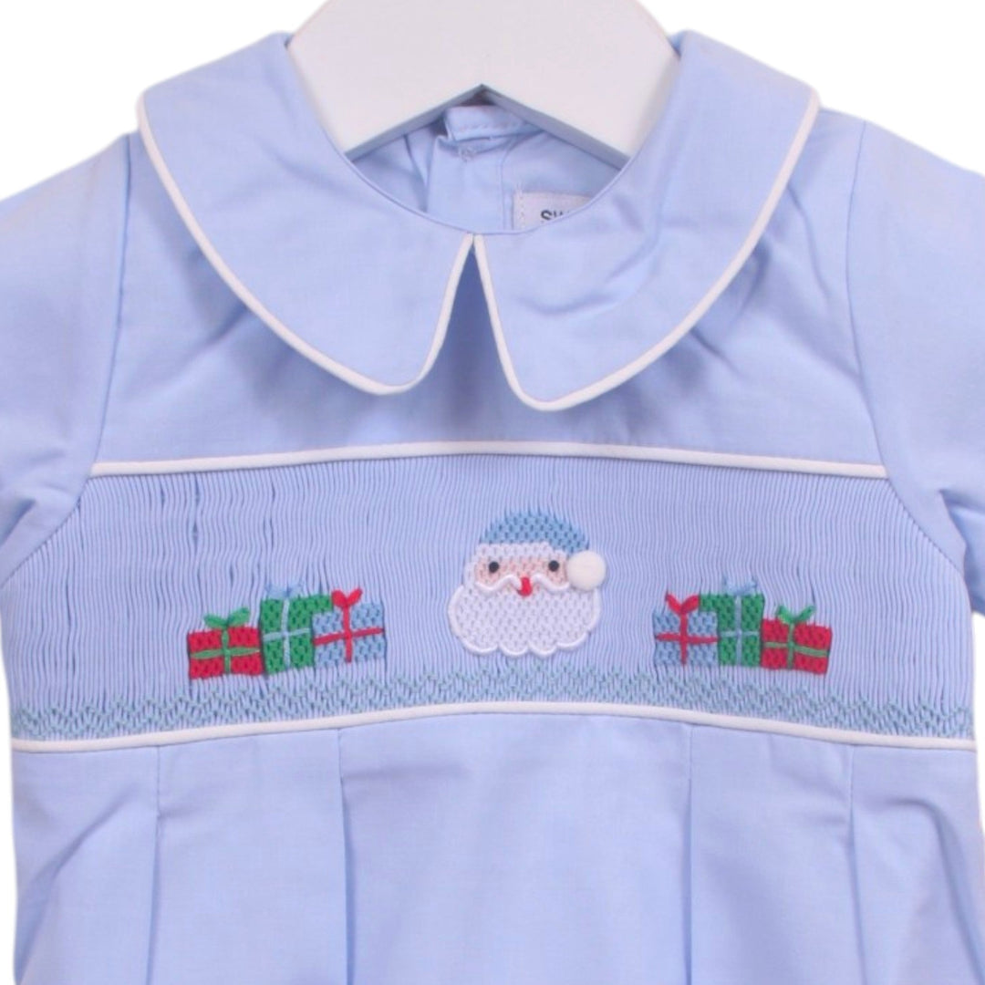 That Store light blue boys bubble with smocked Santa and presents embroidery, peter pan collar, and white piping.