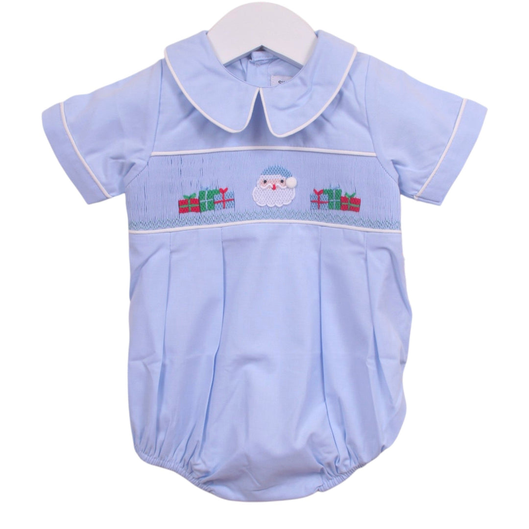 That Store light blue boys bubble with smocked Santa and presents embroidery, Peter Pan collar, and white piping.