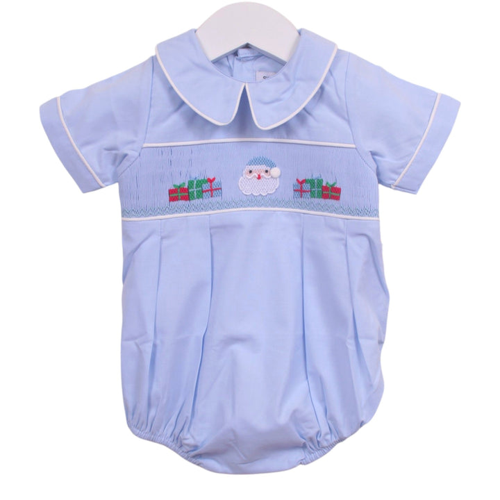 That Store light blue boys bubble with smocked Santa and presents embroidery, Peter Pan collar, and white piping.