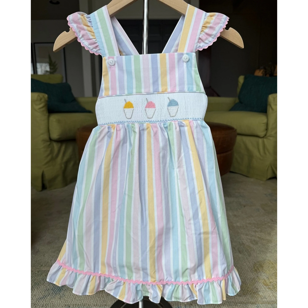 That Store smocked dress featuring pastel striped pattern, ruffle sleeves, and embroidered snow cone details.
