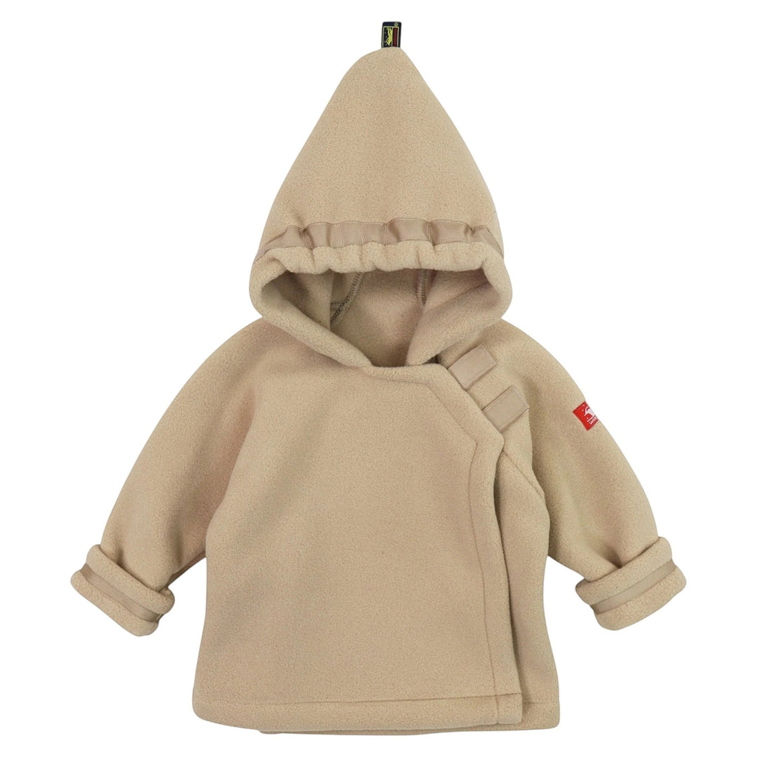 That Store tan Polartec fleece infant jacket with a pointed hood, Velcro closure, and adjustable grosgrain ribbon.