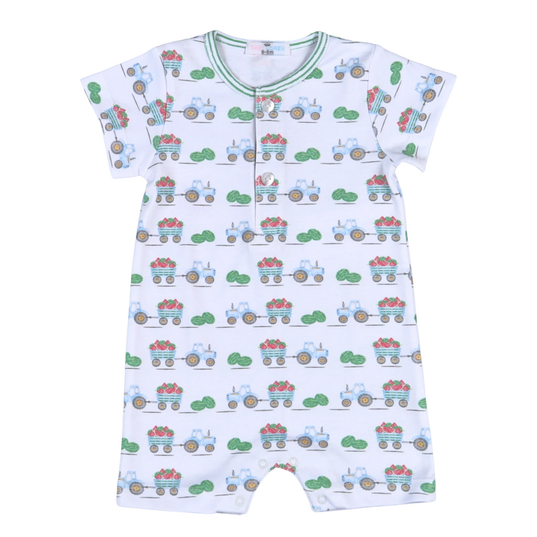 That Store white Pima cotton baby romper with a playful green tractor and watermelon harvest print