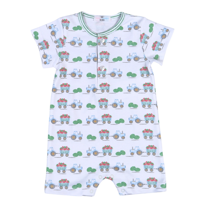 That Store white Pima cotton baby romper with a playful green tractor and watermelon harvest print