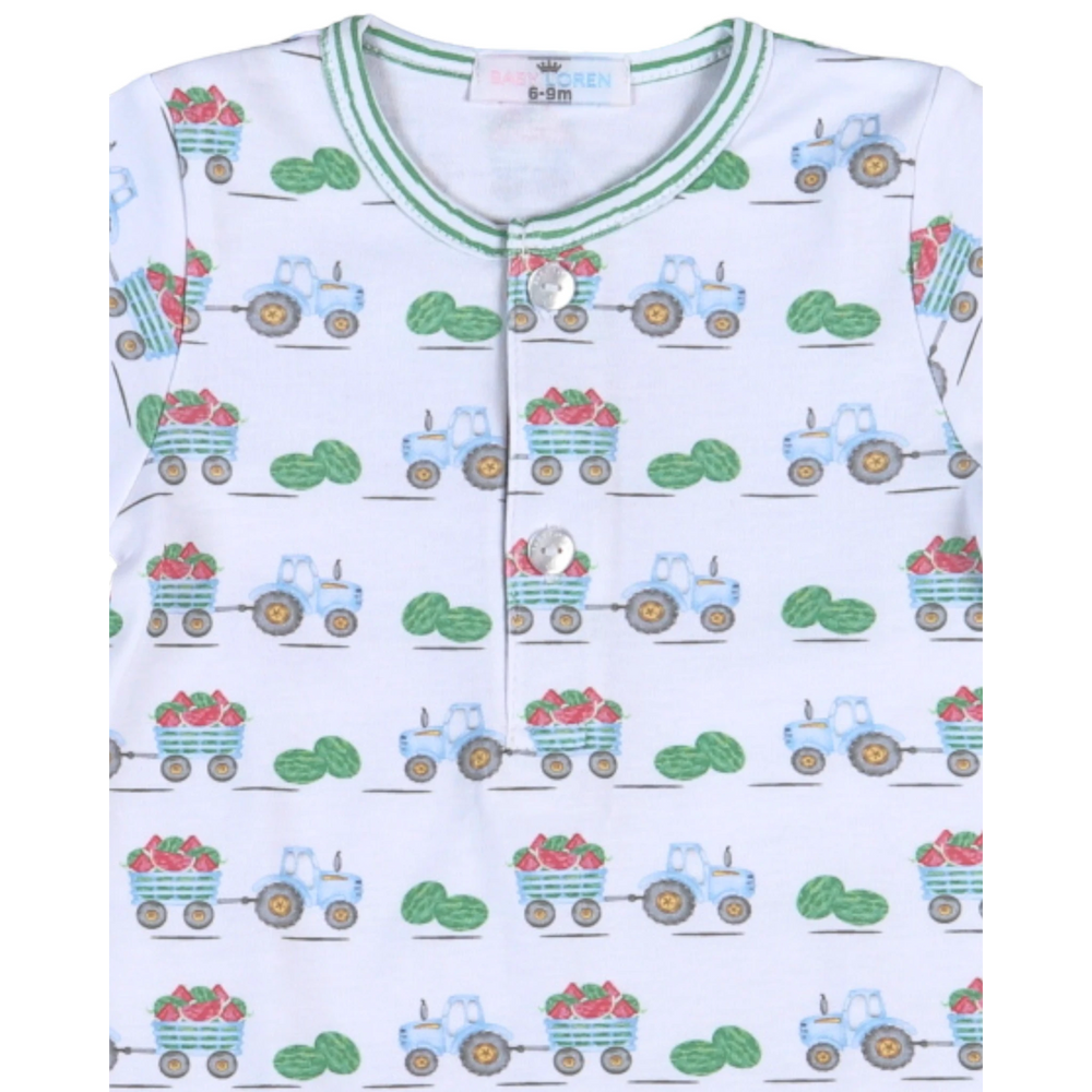 That Store white Pima cotton baby romper with a playful green tractor and watermelon harvest print and button detail.