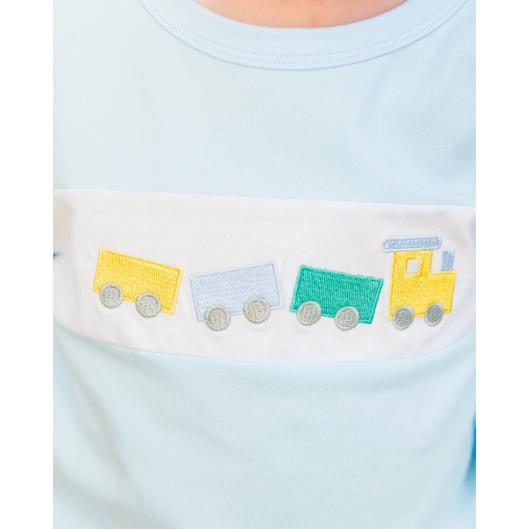 That Store boys light blue jogger set featuring a white chest panel with a colorful embroidered train motif