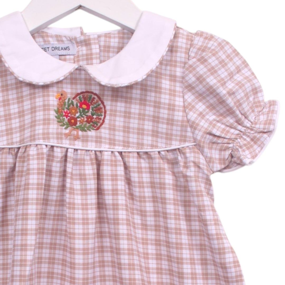 That Store beige and white plaid toddler dress with a white Peter Pan collar and festive turkey embroidery