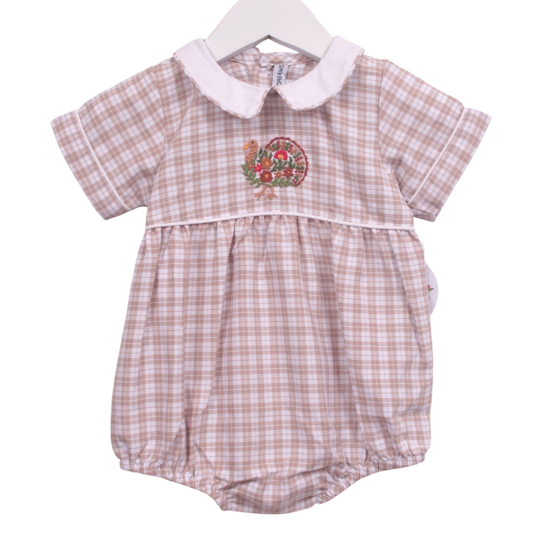 That Store beige plaid baby bubble with a white Peter Pan collar and festive turkey embroidery for Thanksgiving.