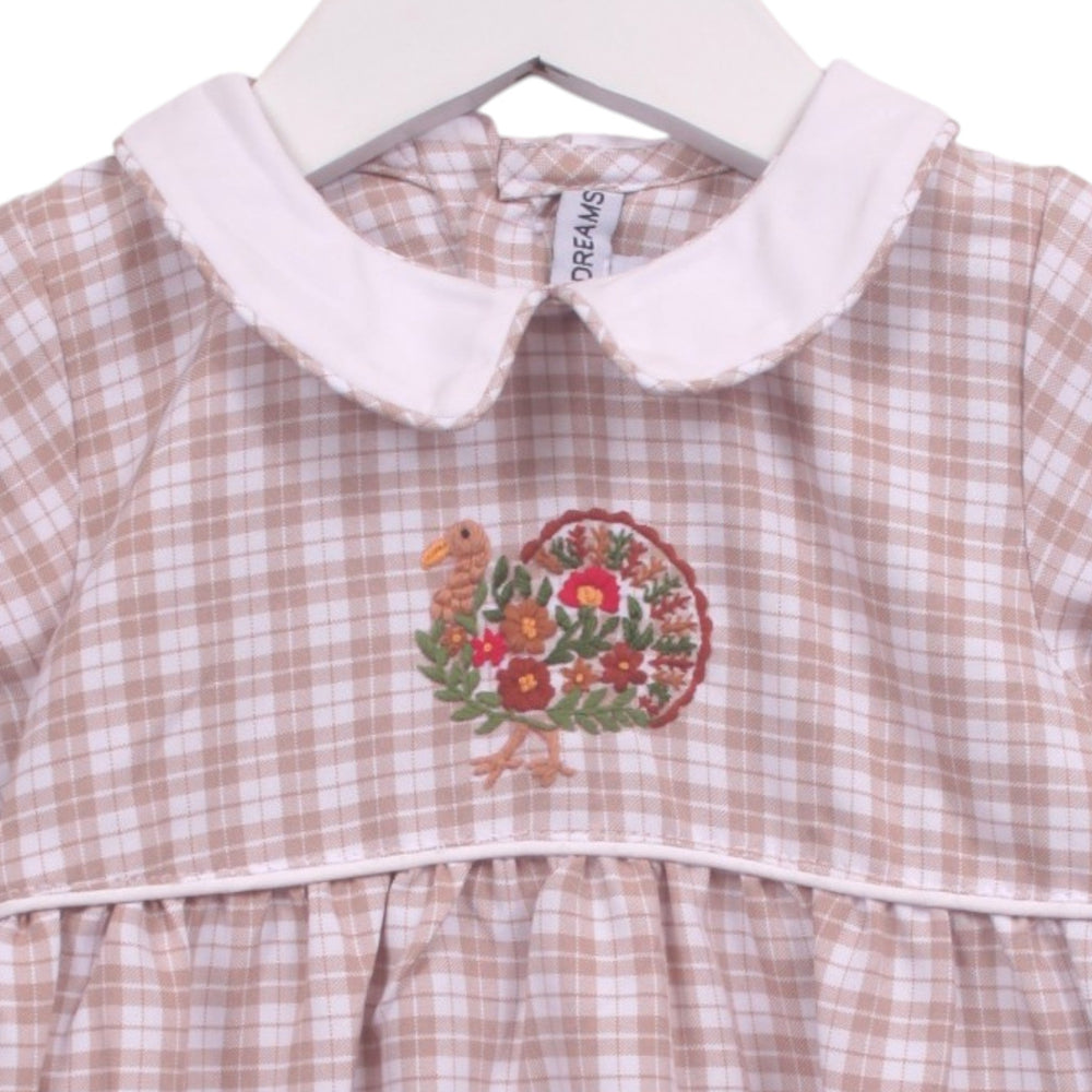 That Store beige and white plaid baby bubble with a white Peter Pan collar and festive turkey embroidery.