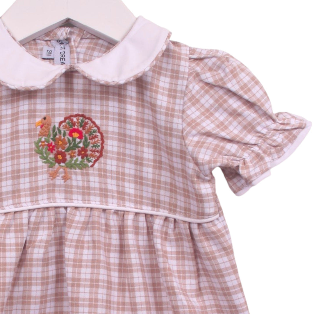 That Store girls bubble in beige plaid with a white Peter Pan collar and detailed turkey embroidery on the bodice.
