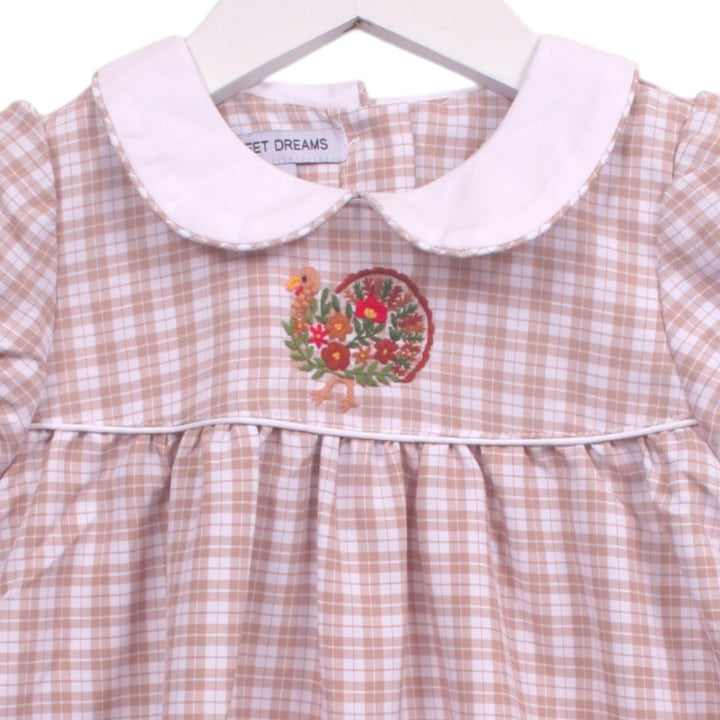 That Store beige plaid toddler dress with white Peter Pan collar and festive turkey embroidery on the bodice