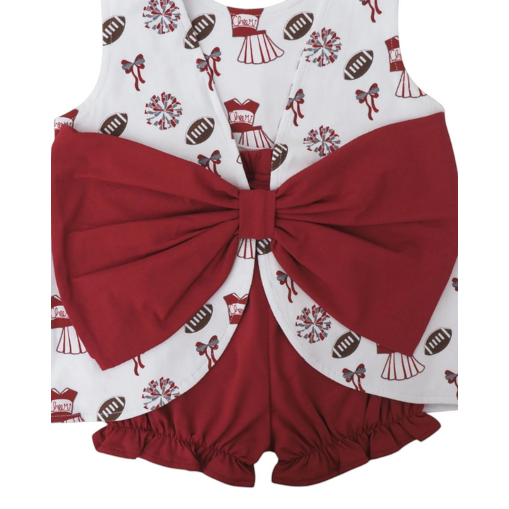 That Store girls varsity bloomer set featuring a white top with football print and a large dark red back bow detail.