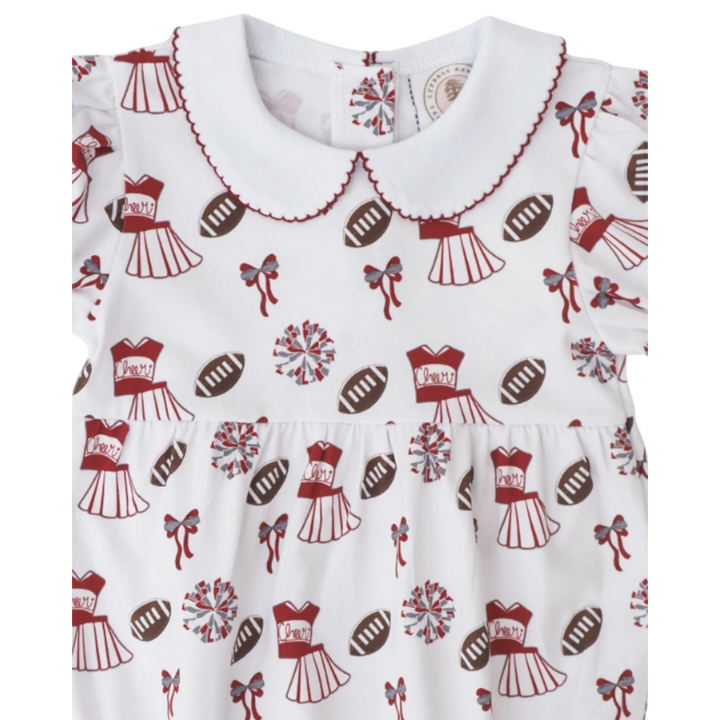 That Store girls bubble featuring a dark red and white cheerleading and football print with a scalloped peter pan collar