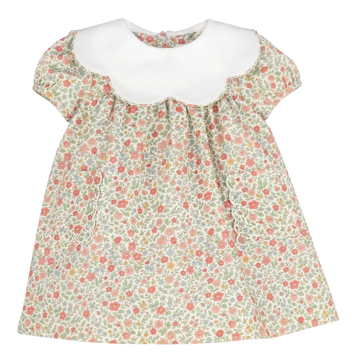 That Store vintage orange floral dress with a white scalloped collar and puff sleeves for girls.