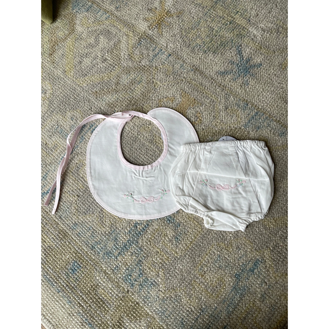 That Store white baby girl diaper cover and matching bib set with delicate pink bow and floral embroidery
