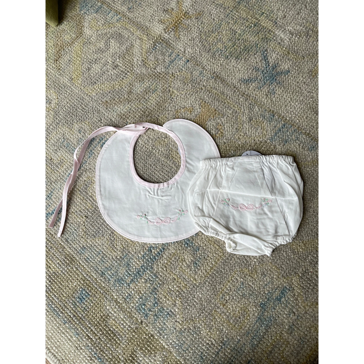 That Store white baby girl diaper cover and matching bib set with delicate pink bow and floral embroidery