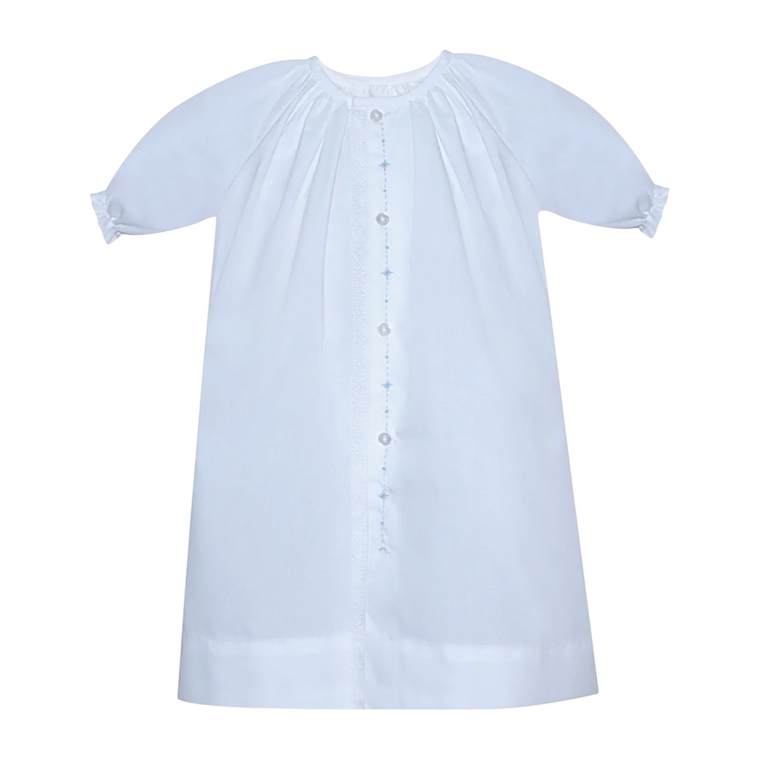 That Store white newborn baby boy daygown with blue diamond embroidery and delicate lace trim detail.