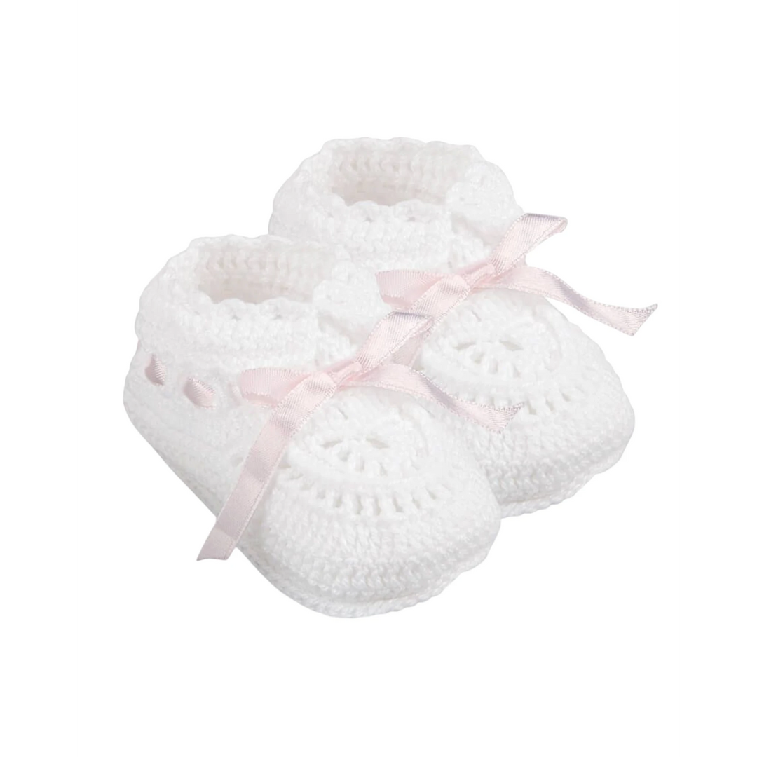 That Store white hand crocheted newborn baby booties with soft cotton texture and delicate pink satin ribbon ties.