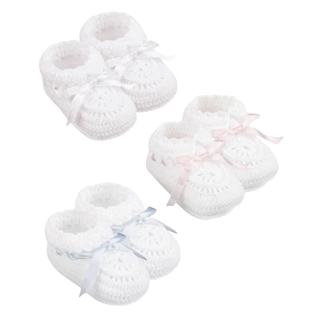 That Store white hand crocheted newborn cotton booties with adjustable satin ribbons in pink, blue, and white.