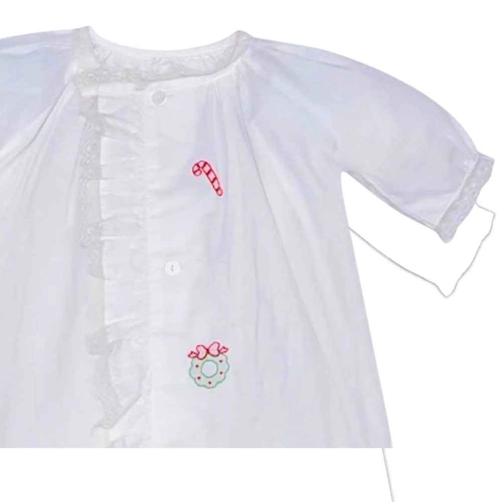 That Store white baby girls daygown with holiday embroidery, ruffled lace trim, and front button closure.