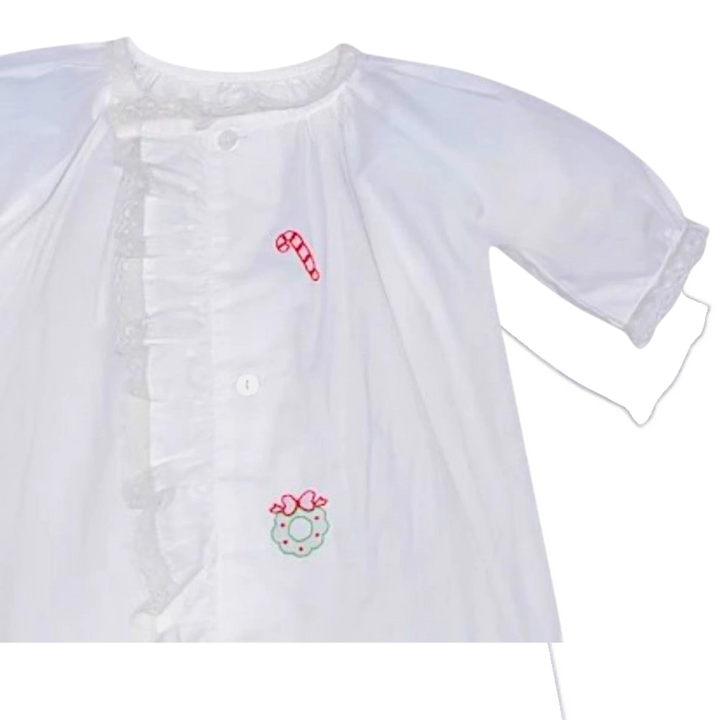 That Store white baby girls daygown with holiday embroidery, ruffled lace trim, and front button closure.