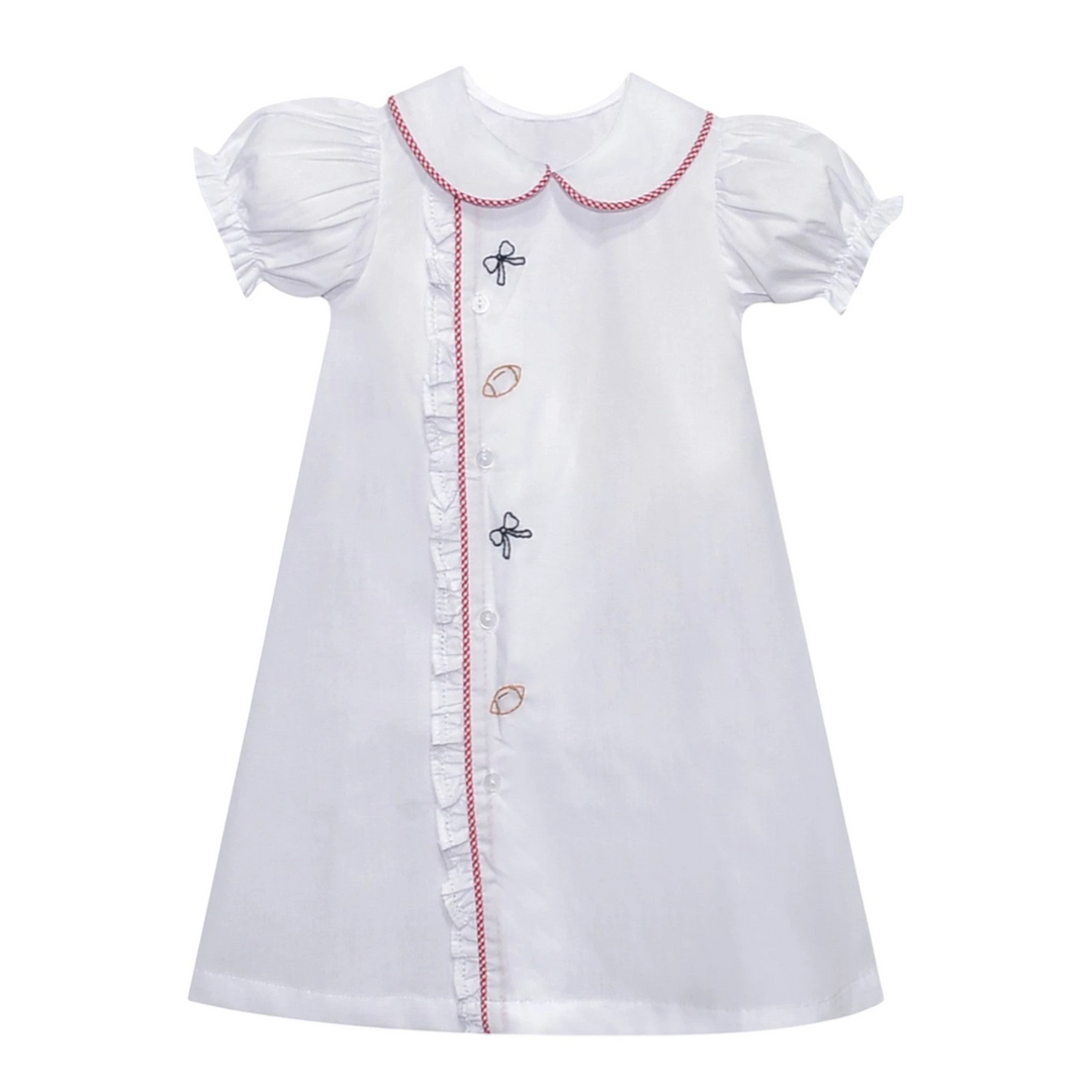 That Store white girls daygown with red gingham trim, ruffled placket, and bow and football embroidery.
