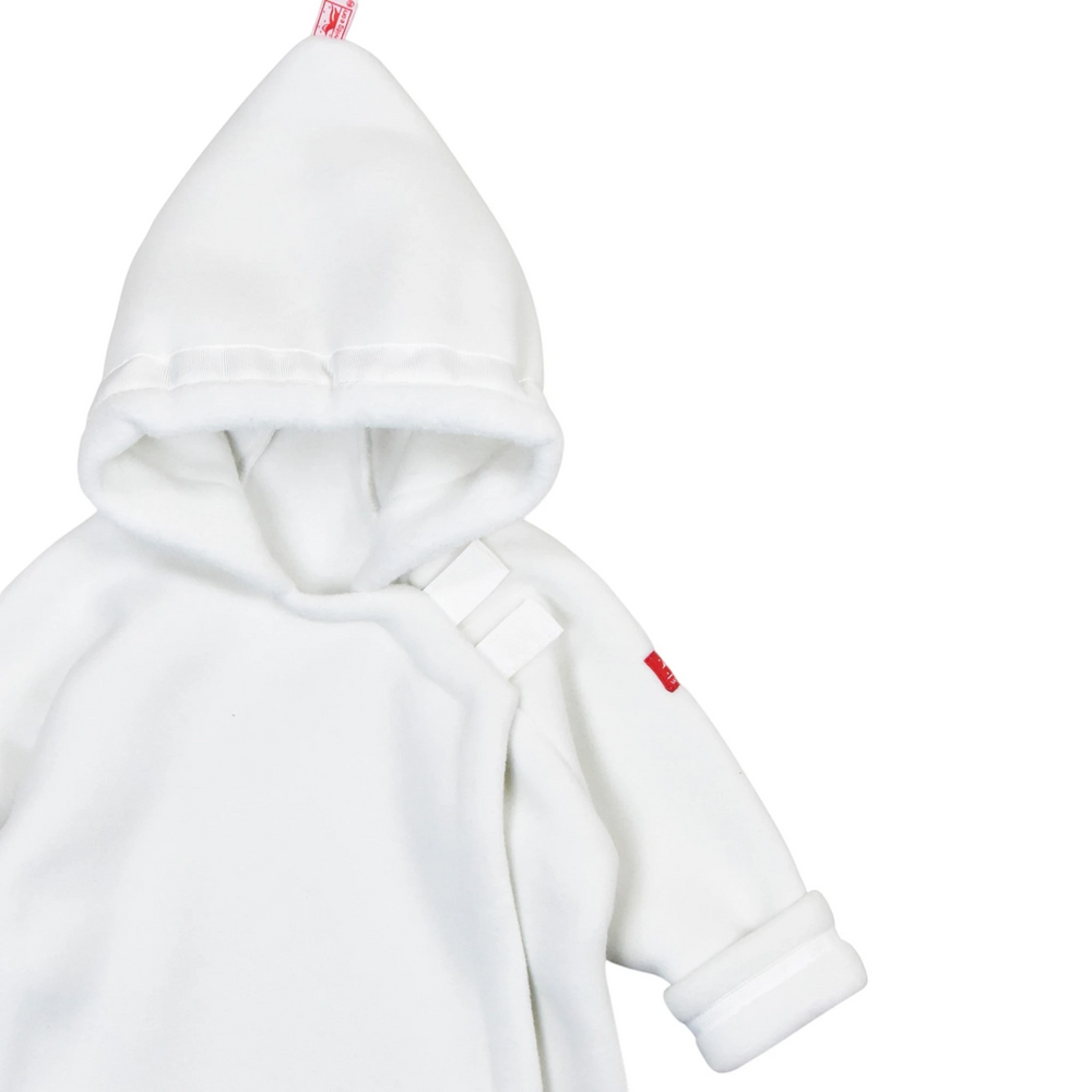 That Store white Polartec fleece infant jacket with a hooded flap-over design and adjustable grosgrain ribbon