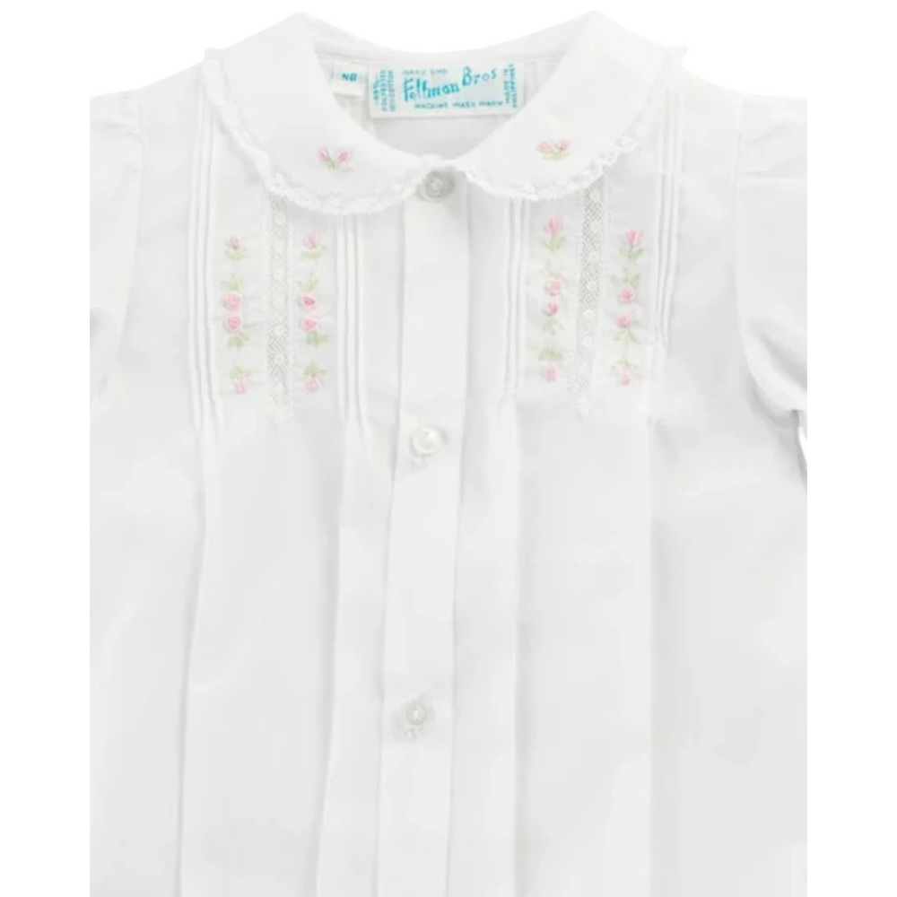 That Store baby girl white gown with pink floral embroidery, lace collar, pintucks, and button-down front.