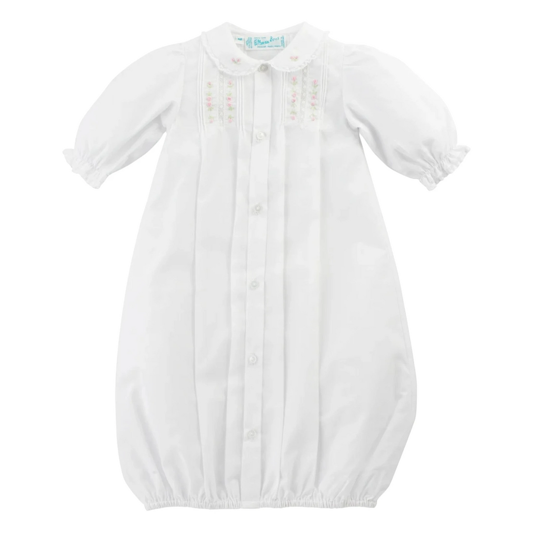 That Store white baby gown with pink floral embroidery, lace collar, pintucks, and button front for baby girls.
