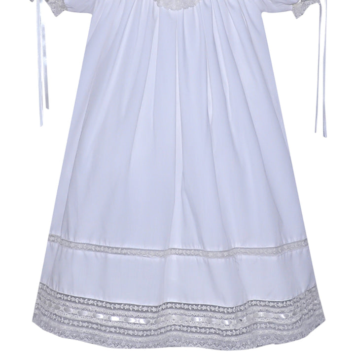 That Store white heirloom dress with ecru lace trim, puff sleeves, and ribbon details for special occasions.