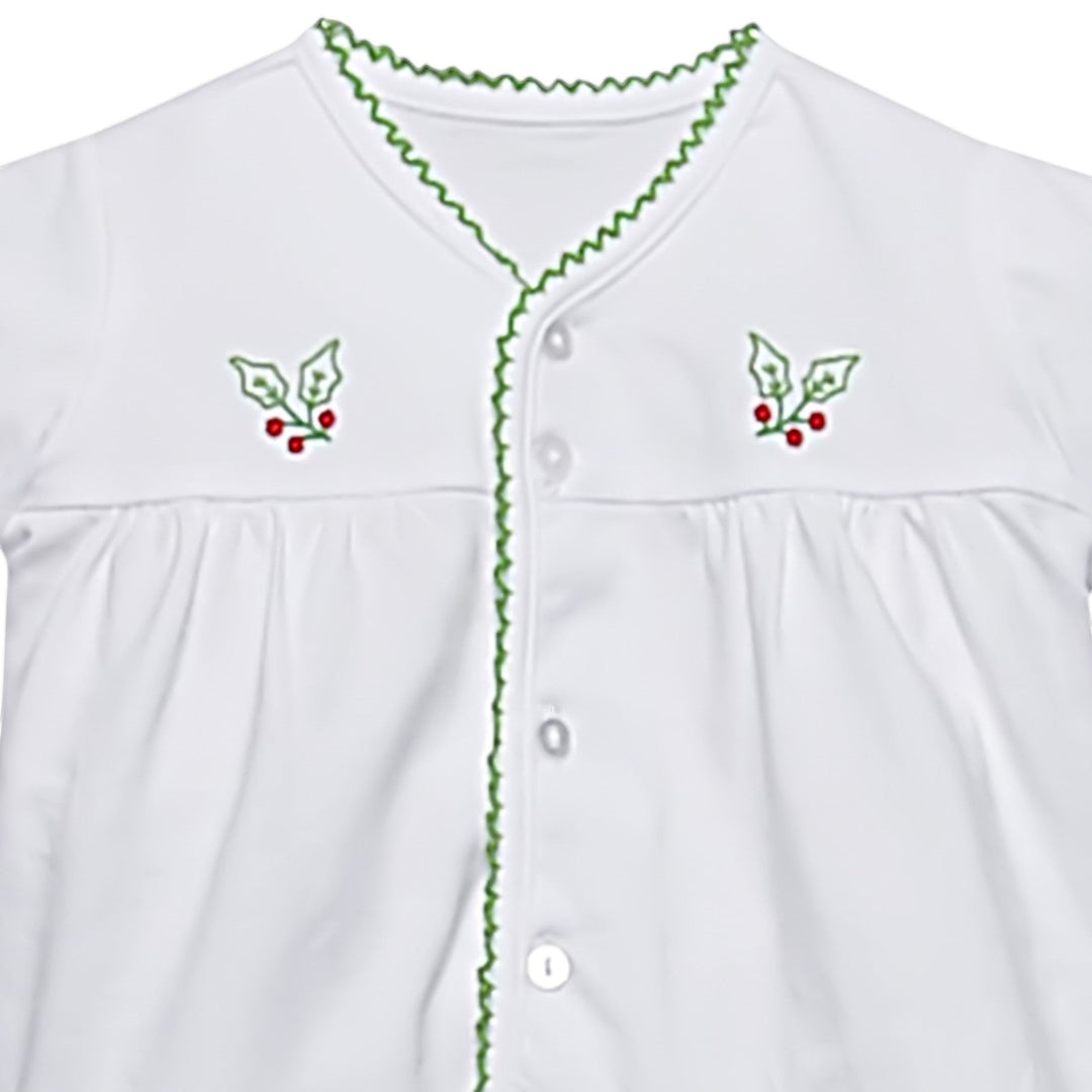 That Store white baby top with green picot trim and embroidered holly berry details on the chest