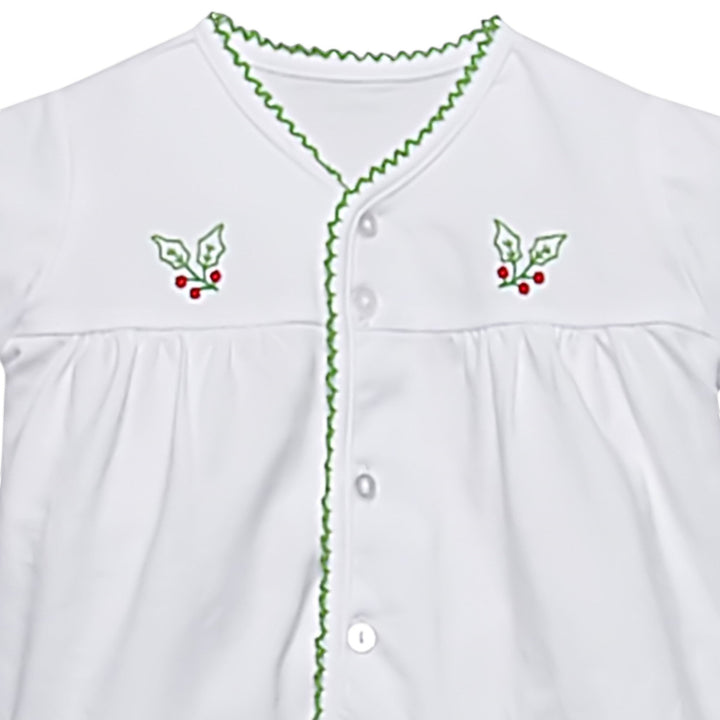 That Store white baby top with green picot trim and embroidered holly berry details on the chest