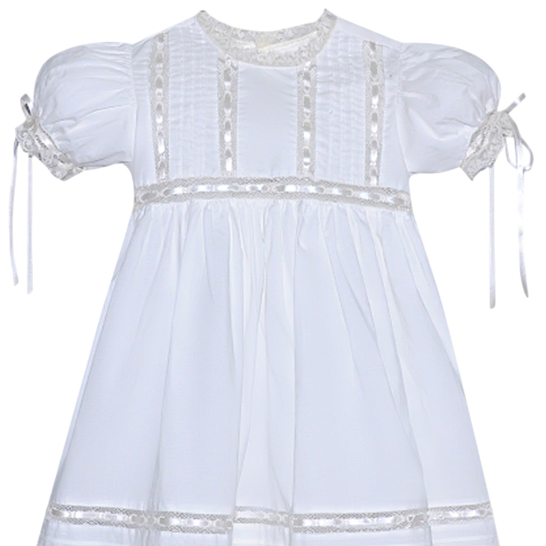 That Store Margaret heirloom white dress with ecru lace trim, satin ribbon accents, and puff sleeves for girls.