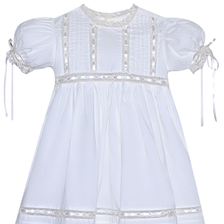 That Store Margaret heirloom white dress with ecru lace trim, satin ribbon accents, and puff sleeves for girls.