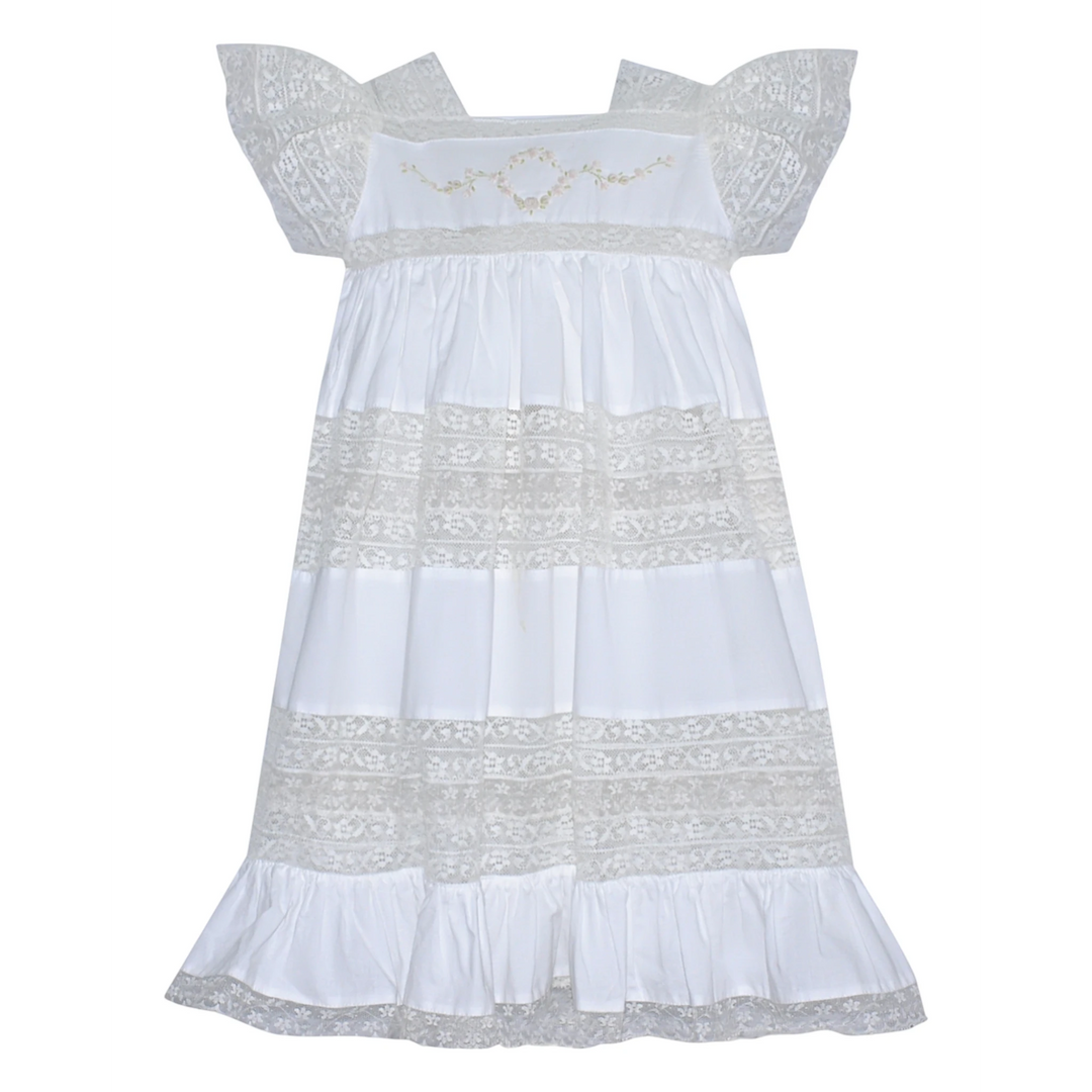 That Store Mary Frances white cotton heirloom dress featuring intricate lace panels and delicate floral embroidery.