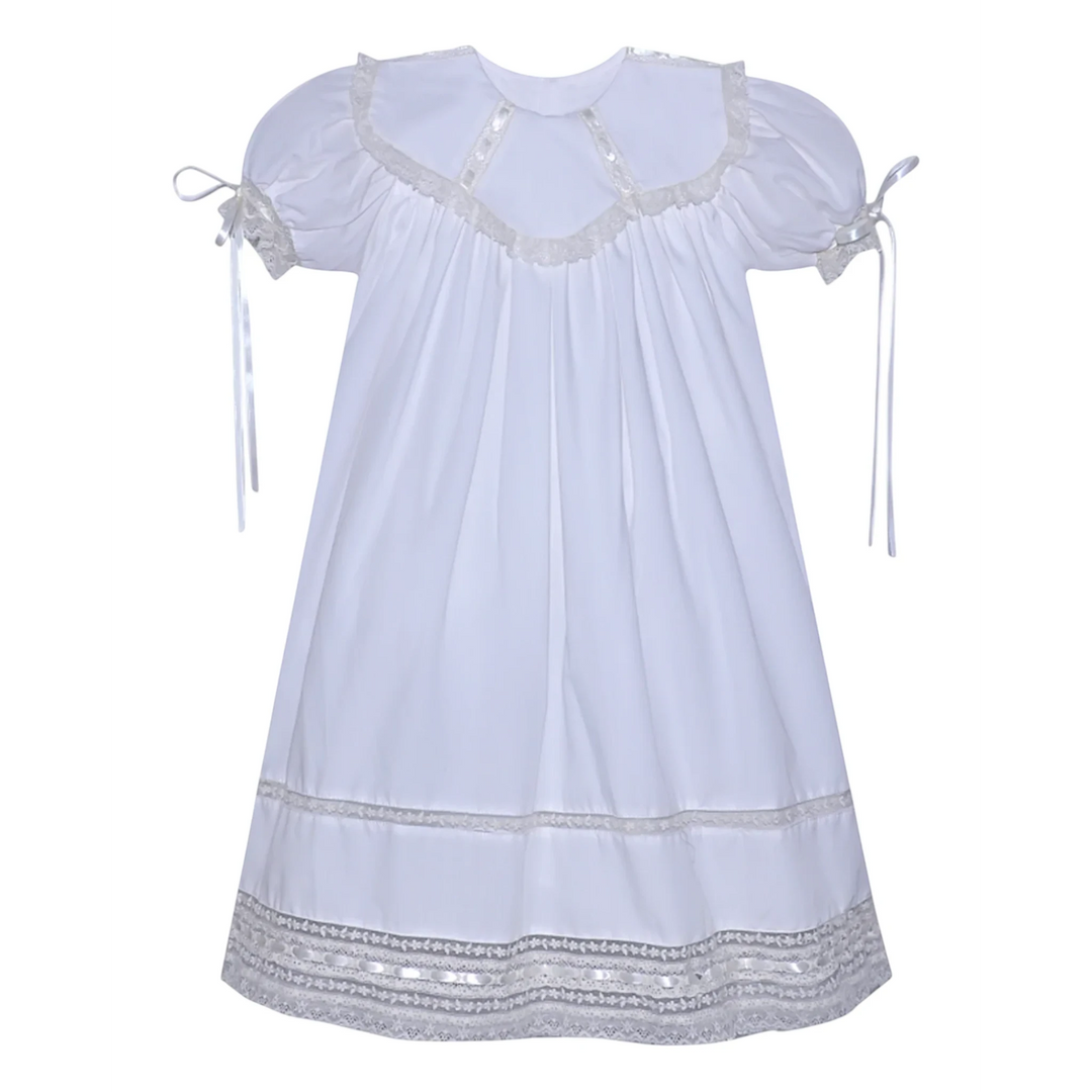That Store white heirloom dress featuring ecru lace trim, puff sleeves with ribbons, and a classic spoke collar.