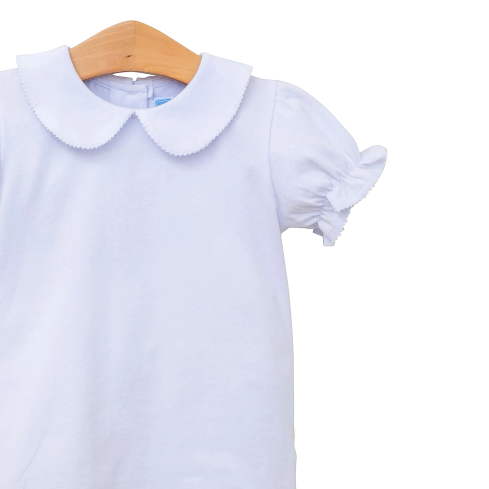 That Store white knit girls top featuring a classic Peter Pan collar and ruffled short sleeves on a wooden hanger.
