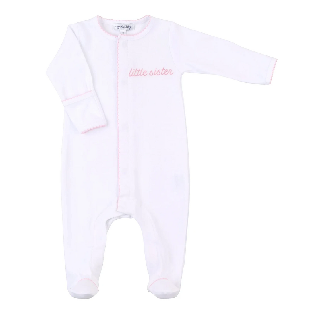 That Store white pima cotton baby footie with pink hand-embroidered Little Sister text and scalloped trim