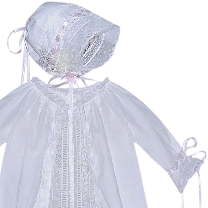 That Store Shiloh white baby daygown with pink ribbon accents, lace trim, and matching bonnet for special occasions.