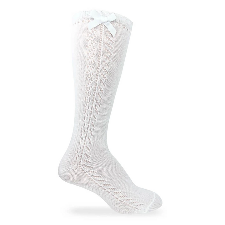 That Store white knee high socks for girls featuring a delicate pointelle knit pattern and a decorative side bow.