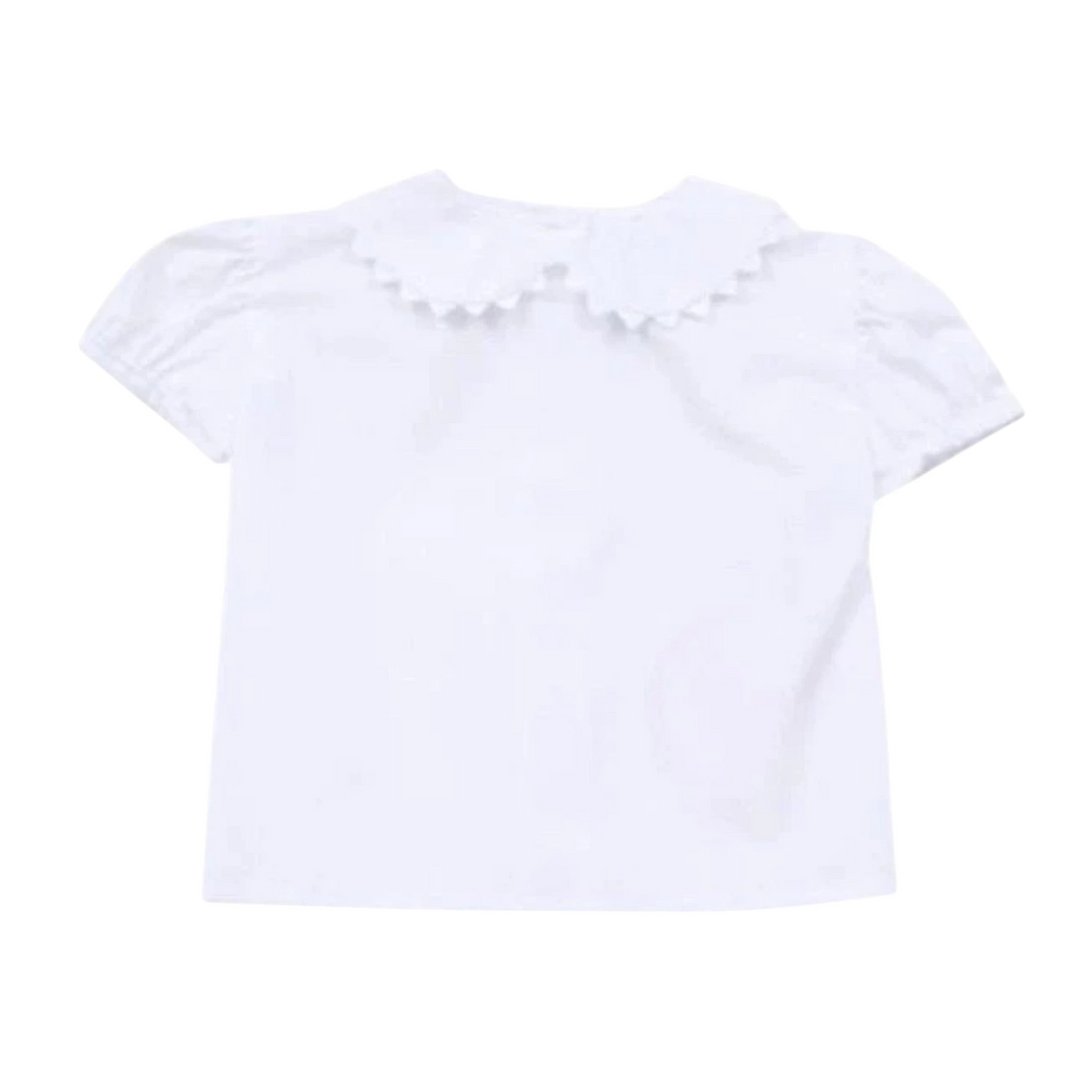 That Store white short sleeve blouse featuring a scalloped ric rac collar and puff sleeves for a classic look.