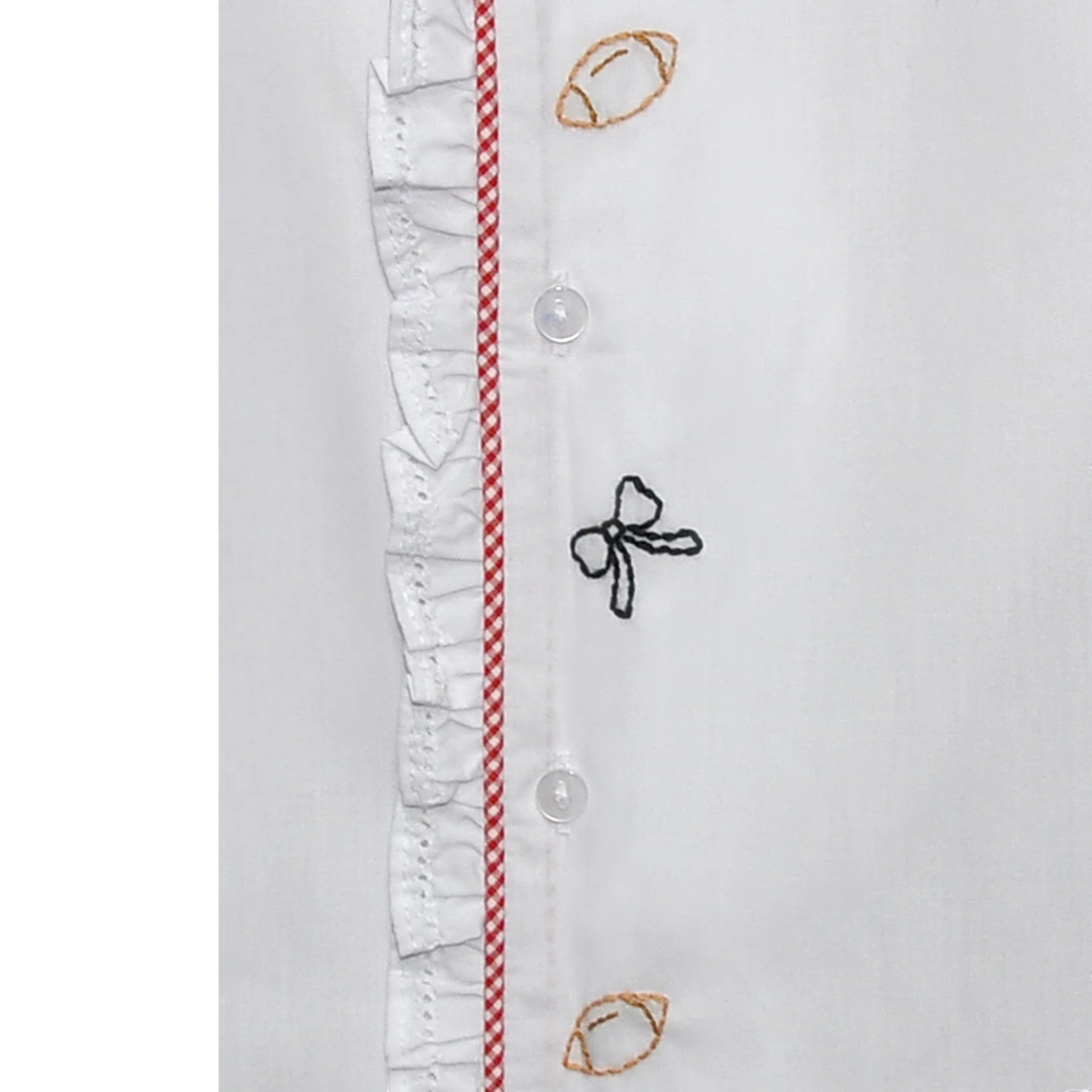 That Store white daygown featuring red gingham trim, ruffled edges, and embroidered bow and football details.