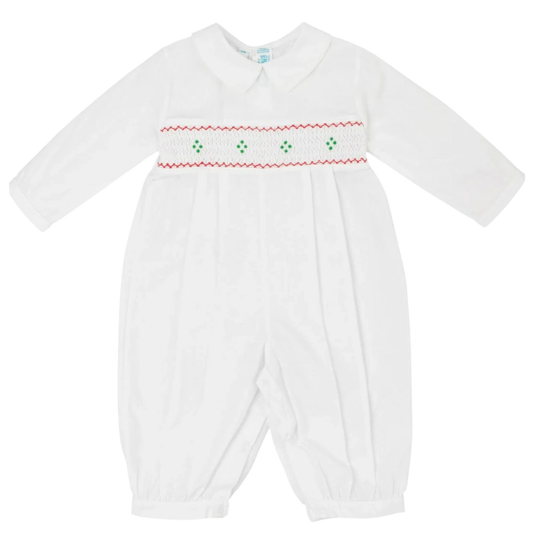 That Store white longall for boys with red and green smocked embroidery, lace-edged collar, and pleated front.