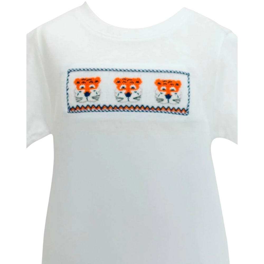 That Store white short-sleeve shirt featuring a smocked panel with three embroidered orange and navy tiger faces