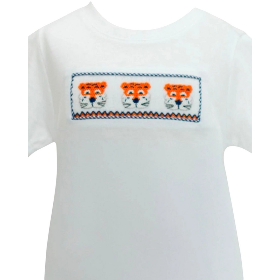 That Store white short-sleeve shirt featuring a smocked panel with three embroidered orange and navy tiger faces